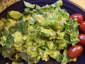 romaine salad with cherry tomatoes and zesty lemon lime vinaigrette